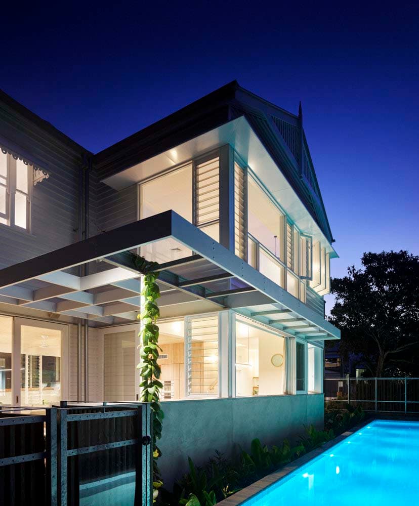 Rear facade featuring lap pool at Perimeter House, built by Brisbane custom home builders Bluebird Design & Build